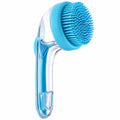 A silicone neck massager brush set with a clear handle, light blue silicone bristles, a blue oval scrubber pad, and three interchangeable brush tip covers in light blue, green, and teal. A hand holds one of the oval pads in the top right corner, and a '6 pack' badge is in the top right corner.